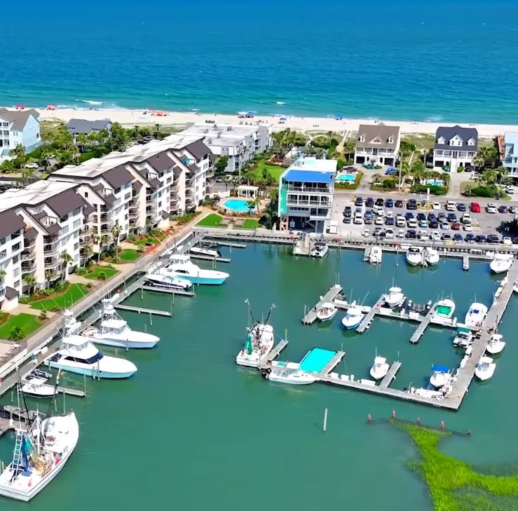 Boats and marina buildings along the inlet today